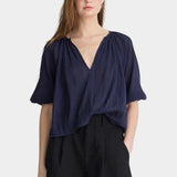 Front view of Apiece Apart Lo Campo Shirt Navy lightweight organic cotton top with puff sleeves