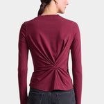 Apiece Apart Long Sleeve Volta Top in Black Cherry with twist front detail styled with black trousers at YUCCA Denver