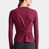 Apiece Apart Long Sleeve Volta Top in Black Cherry with twist front detail styled with black trousers at YUCCA Denver