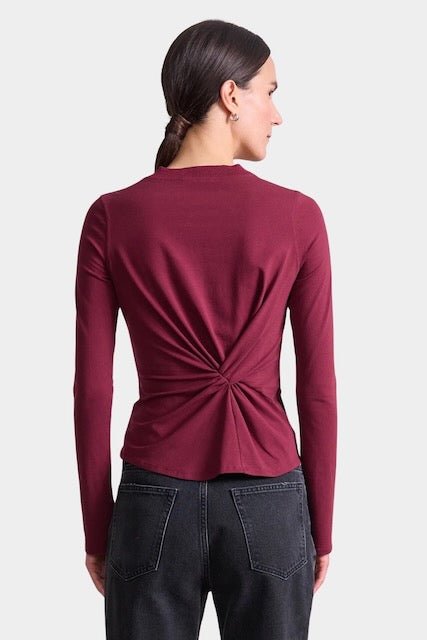 Apiece Apart Long Sleeve Volta Top in Black Cherry with twist front detail styled with black trousers at YUCCA Denver