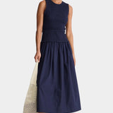 Midnight navy smocked bodice maxi dress sleeveless crew neck organic cotton A-line silhouette full length front view