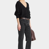 Apiece Apart Softest Silk Cashmere V Neck Black sweater styled with cropped jeans