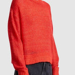 Apiece Apart Softest Tissue Weight Sweater in Tigerlily red cashmere silk knit styled with black trousers at YUCCA Denver
