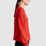 Apiece Apart Softest Tissue Weight Sweater in Tigerlily red cashmere silk knit styled with black trousers at YUCCA Denver