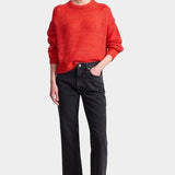 Apiece Apart Softest Tissue Weight Sweater in Tigerlily red cashmere silk knit styled with black trousers at YUCCA Denver