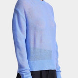 Apiece Apart Softest Tissue Weight Sweater in Cornflower blue cashmere silk knit styled with tailored trousers at YUCCA Denver