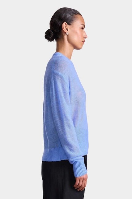 Apiece Apart Softest Tissue Weight Sweater in Cornflower blue cashmere silk knit styled with tailored trousers at YUCCA Denver
