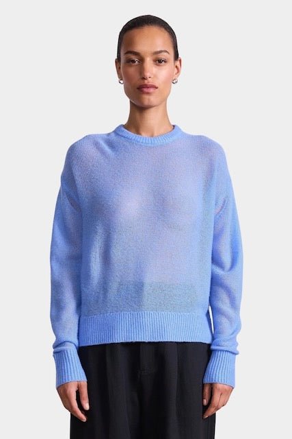 Apiece Apart Softest Tissue Weight Sweater in Cornflower blue cashmere silk knit styled with tailored trousers at YUCCA Denver