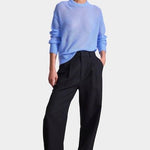 Apiece Apart Softest Tissue Weight Sweater in Cornflower blue cashmere silk knit styled with tailored trousers at YUCCA Denver