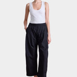 Apiece Apart Spa Pleat Pant black organic cotton pleated barrel leg trousers front view