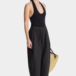 Side view of Apiece Apart Spa Pleat Pant Black lightweight relaxed trouser with gathered waistband