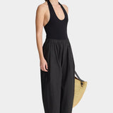 Side view of Apiece Apart Spa Pleat Pant Black lightweight relaxed trouser with gathered waistband