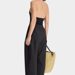 Back view of Apiece Apart Spa Pleat Pant Black with relaxed drape and easy volume through the leg