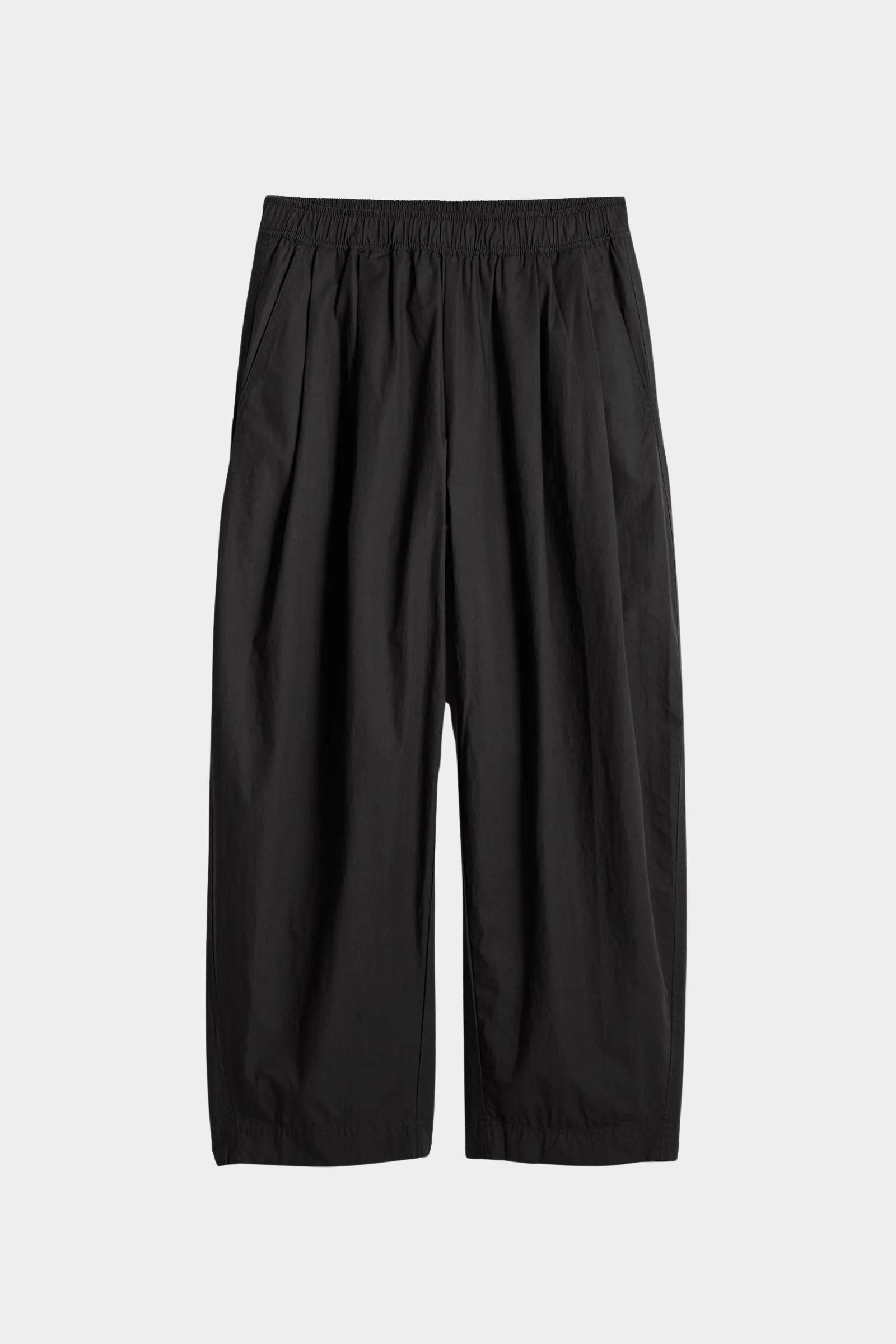 Apiece Apart Spa Pleat Pant Black with elastic waist and softly tapered wide leg silhouette