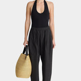 Apiece Apart Spa Pleat Pant Black relaxed cotton pull-on pant styled with halter bodysuit and woven tote at YUCCA Denver