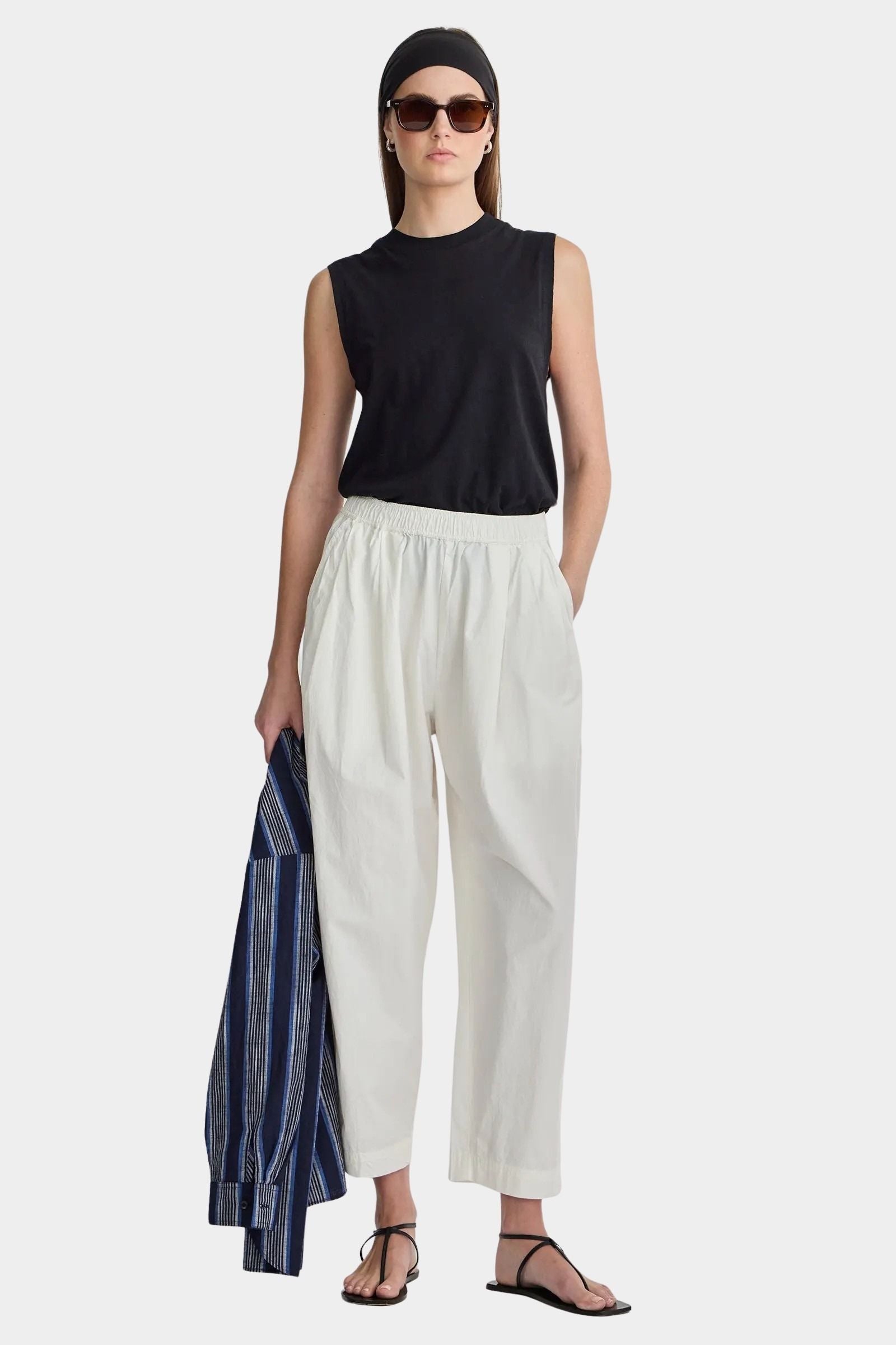 Apiece Apart Spa Pleat Pant Cream front styling view with elastic waist barrel leg silhouette and organic cotton fabrication