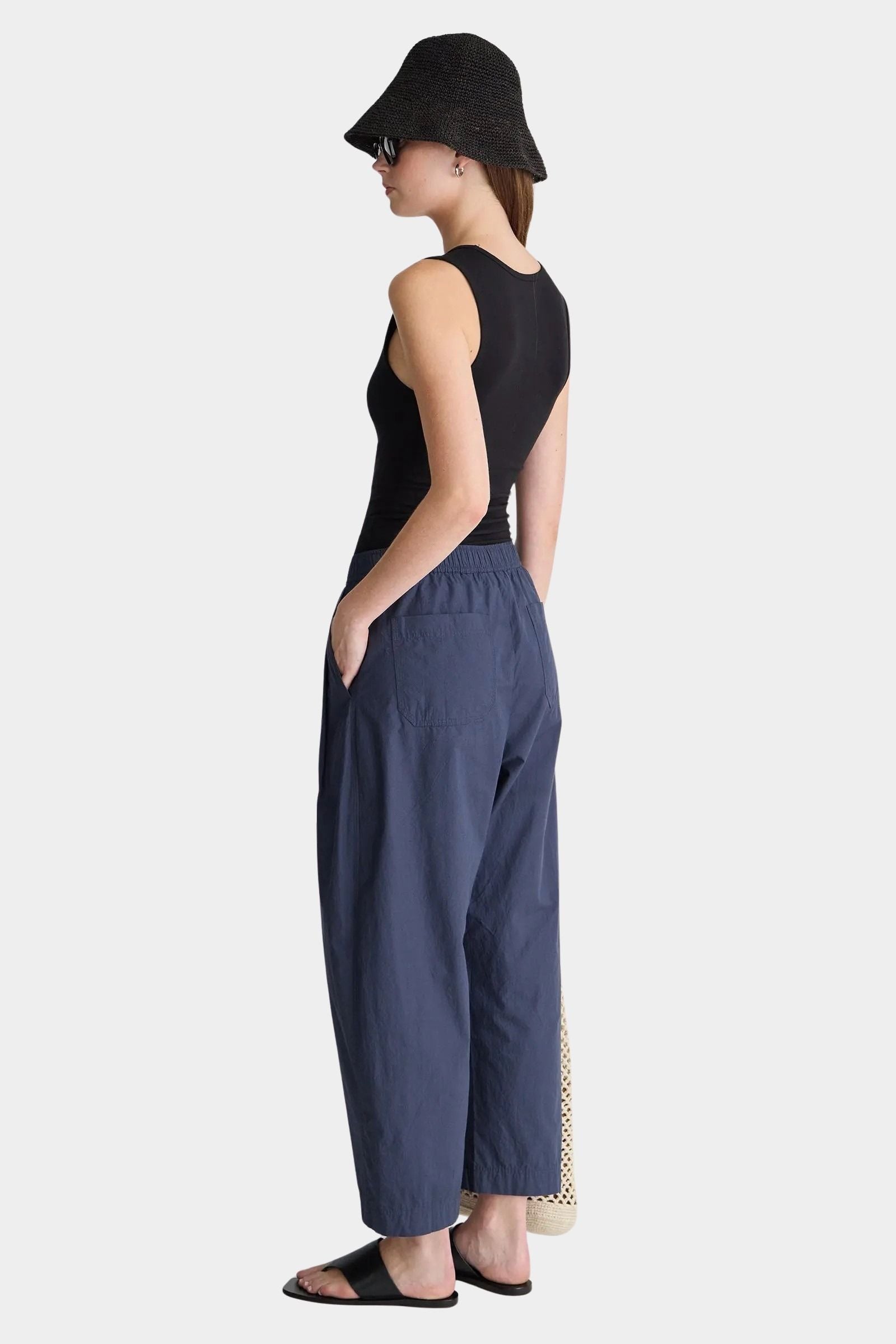 Apiece Apart Spa Pleat Pant Navy back view with patch pocket detail and relaxed cropped shape at YUCCA Denver