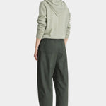 Apiece Apart Spa Pleat Pant Rosin back view featuring patch pockets, an elastic waistband, and a relaxed cropped fit.