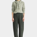 Apiece Apart Spa Pleat Pant Rosin side view showcasing the sculptural barrel leg shape, front pleats, and side pocket detail.