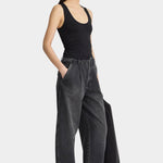 Apiece Apart Uri Low Cut Tank Black fitted scoop neck tank styled with wide leg jeans at YUCCA Denver