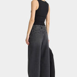 Apiece Apart Uri Low Cut Tank Black fitted tank back view with wide leg jeans