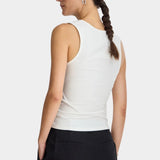 Apiece Apart Uri Low-Cut Tank Cream back view with fitted stretch silhouette and tailored black trousers
