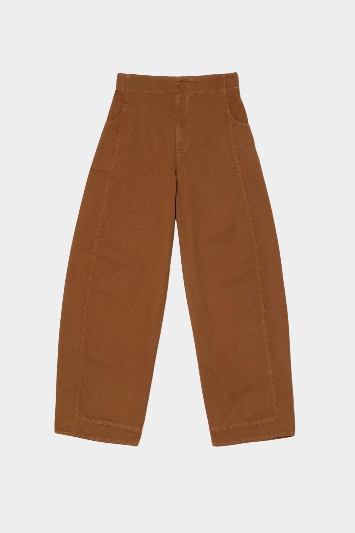 Atelier Delphine Dakar barrel leg pants in summer brown flat lay showing high rise waist and wide leg silhouette