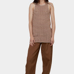 Atelier Delphine Dakar barrel leg pants in summer brown worn on model side view showing relaxed leg shape