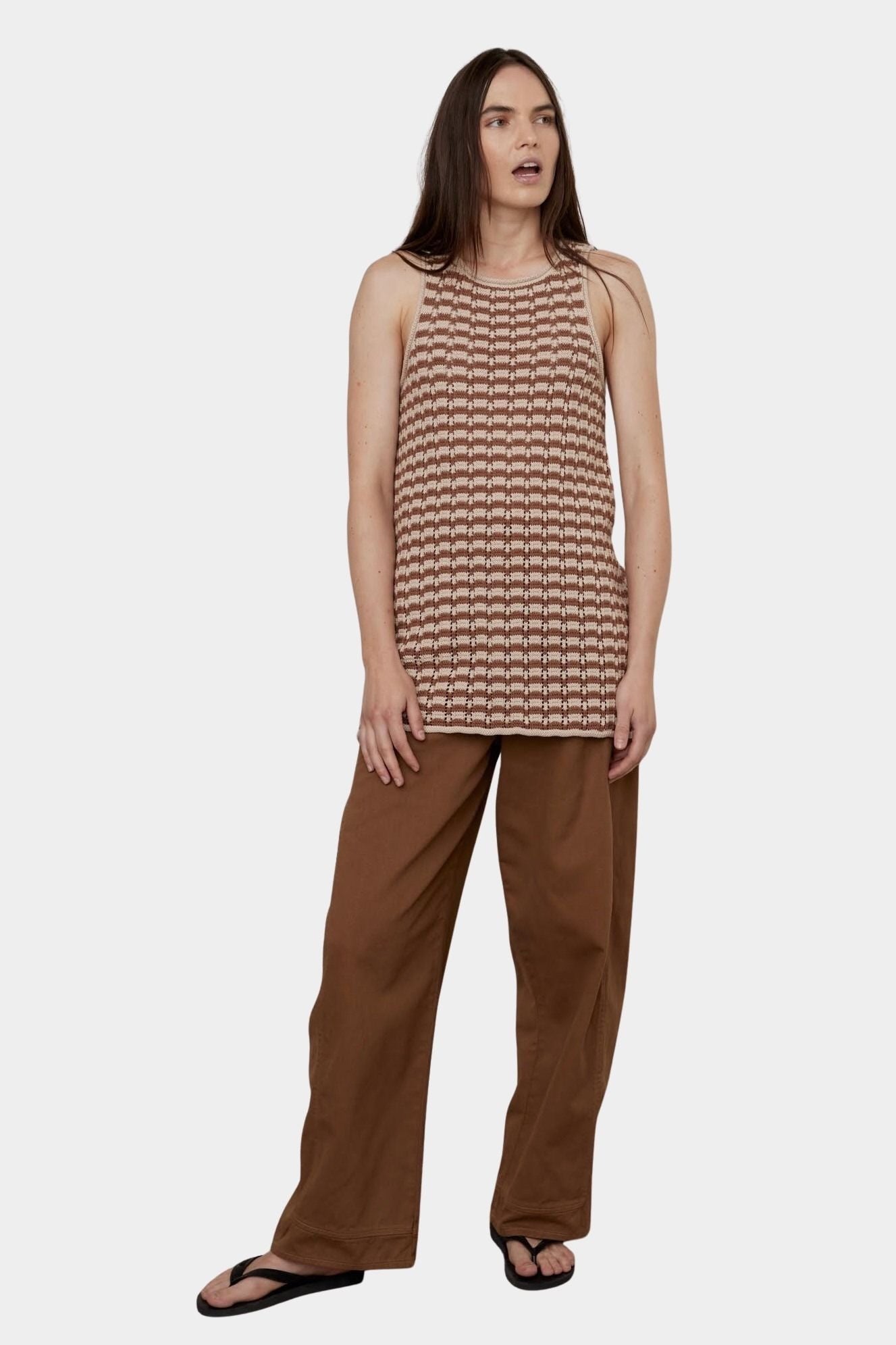 Atelier Delphine Dakar barrel leg pants in summer brown worn on model side view showing relaxed leg shape