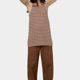 Atelier Delphine Dakar barrel leg pants in summer brown worn on model with high rise waist and relaxed fit