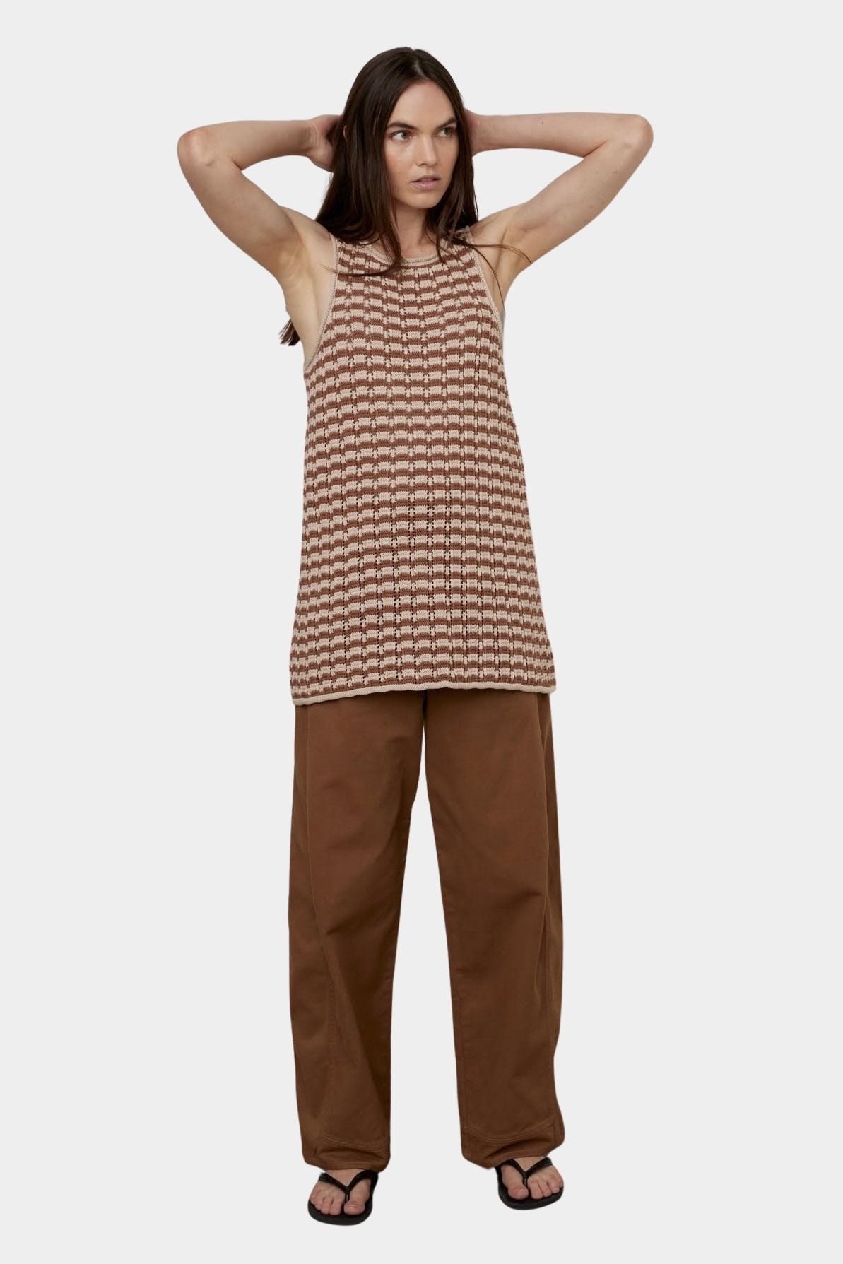 Atelier Delphine Dakar barrel leg pants in summer brown worn on model with high rise waist and relaxed fit