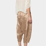 Atelier Delphine Kiko pant in latte angled back view showing textured fabric and elastic waistband