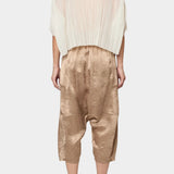 Atelier Delphine Kiko pant in latte back view showing relaxed drop crotch silhouette and cropped length
