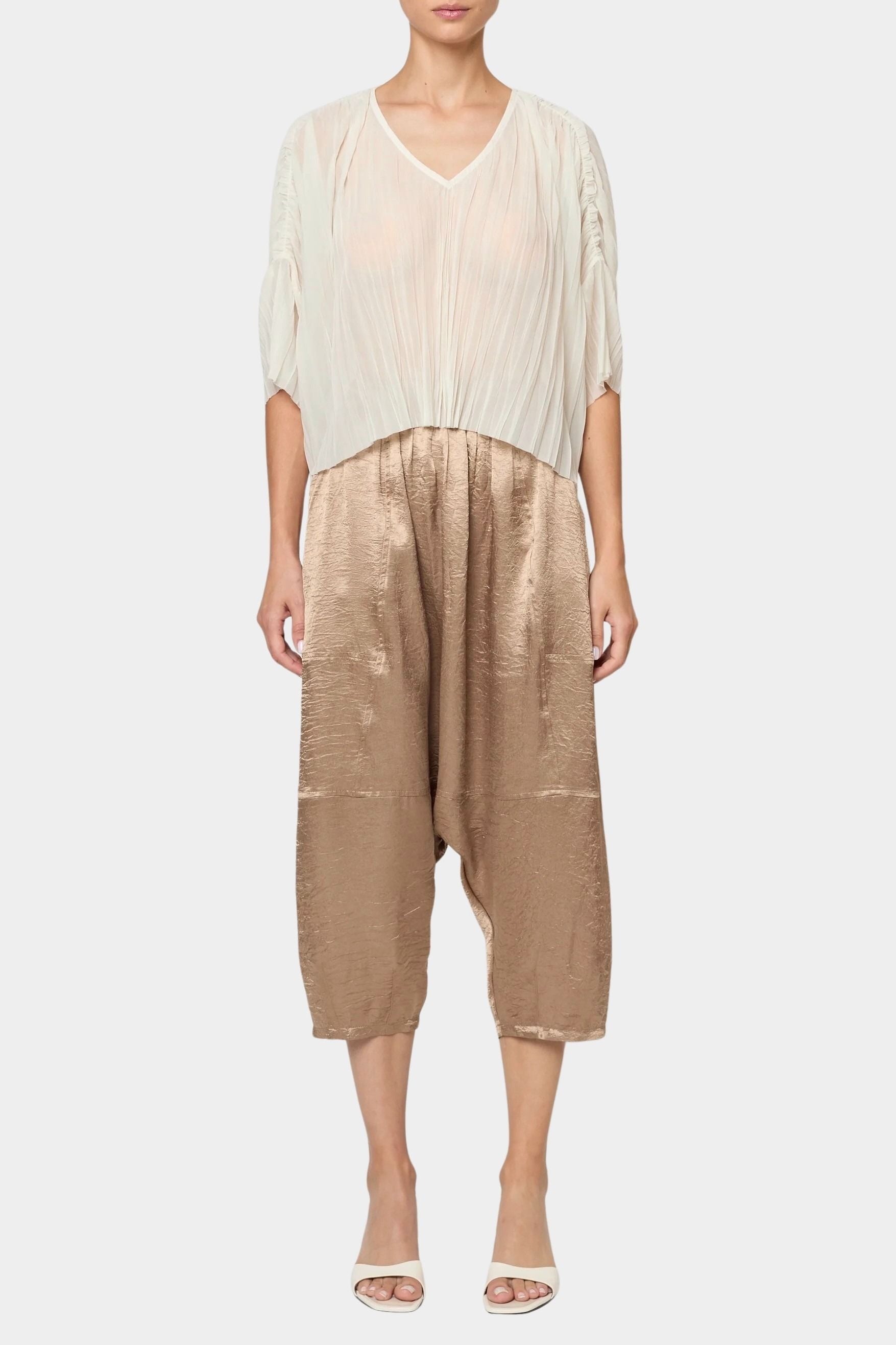 Atelier Delphine Kiko pant in latte full front outfit view showing relaxed drop crotch fit and elastic waist