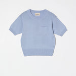 Atelier Delphine Mari Mari knit top pastel blue product flat lay with short sleeves and pocket detail