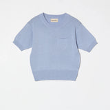 Atelier Delphine Mari Mari knit top pastel blue product flat lay with short sleeves and pocket detail