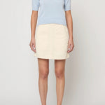 Atelier Delphine Mari knit top pastel blue front on model with chest pocket and fitted shape