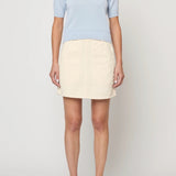 Atelier Delphine Mari knit top pastel blue front on model with chest pocket and fitted shape