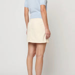 Atelier Delphine Mari knit top in pastel blue front view with short sleeves and chest pocket