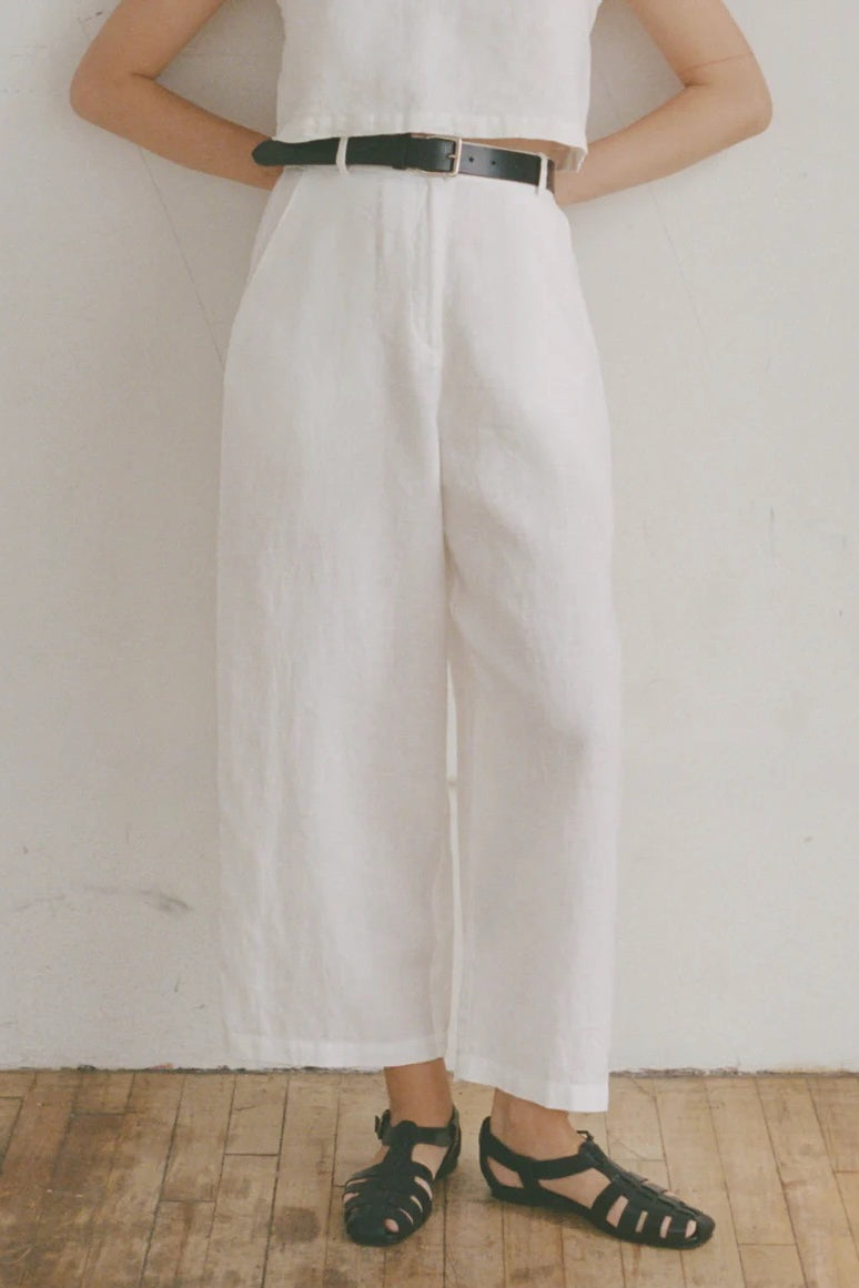 Shaina Mote Paradis trouser in natural organic cotton close-up of front with flat waistband, zipper fly and relaxed leg