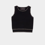 Atelier Delphine knit tank top in black and tan flat lay showing cropped silhouette and contrast stitching detail