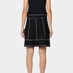 Atelier Delphine knit tank top in black and tan back detail showing sleeveless cut and contrast stitch trim
