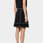 Atelier Delphine knit tank top in black and tan back view with contrast stitch trim and sleeveless silhouette