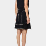 Atelier Delphine knit tank top in black and tan back view with contrast stitch trim and sleeveless silhouette