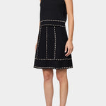 Atelier Delphine knit tank top in black and tan worn with matching knit skirt showing sleeveless cropped fit