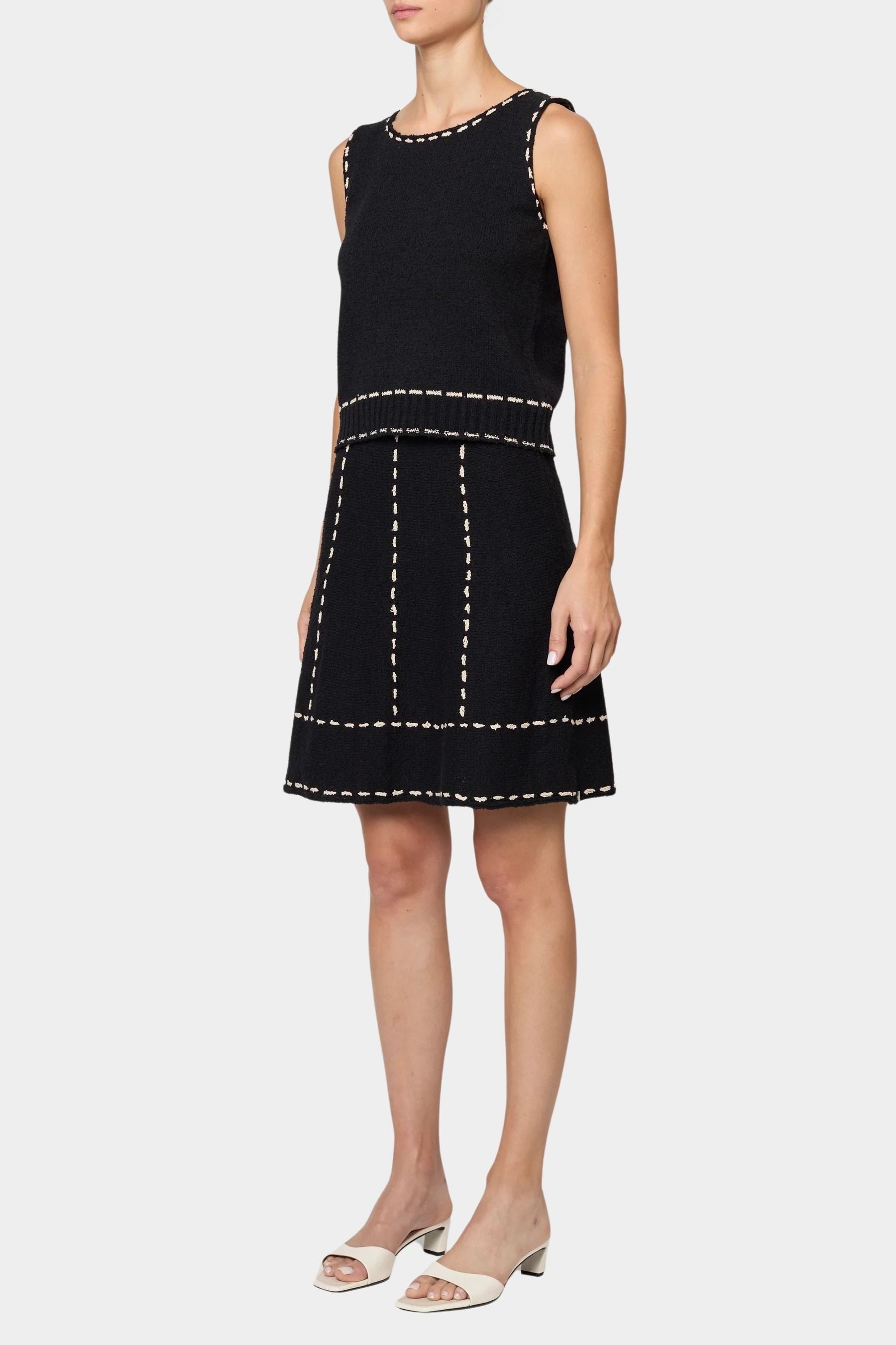 Atelier Delphine knit tank top in black and tan worn with matching knit skirt showing sleeveless cropped fit