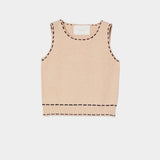 Atelier Delphine knit tank top in grain and navy flat lay showing sleeveless silhouette and contrast stitching detail