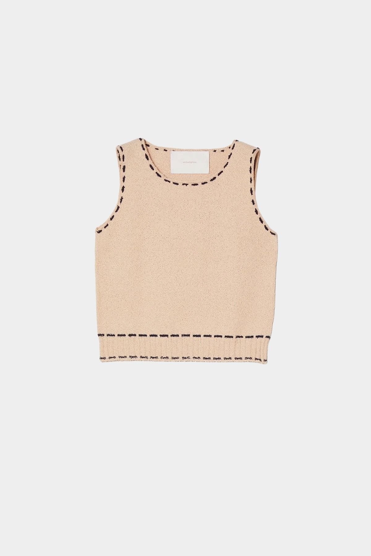 Atelier Delphine knit tank top in grain and navy flat lay showing sleeveless silhouette and contrast stitching detail