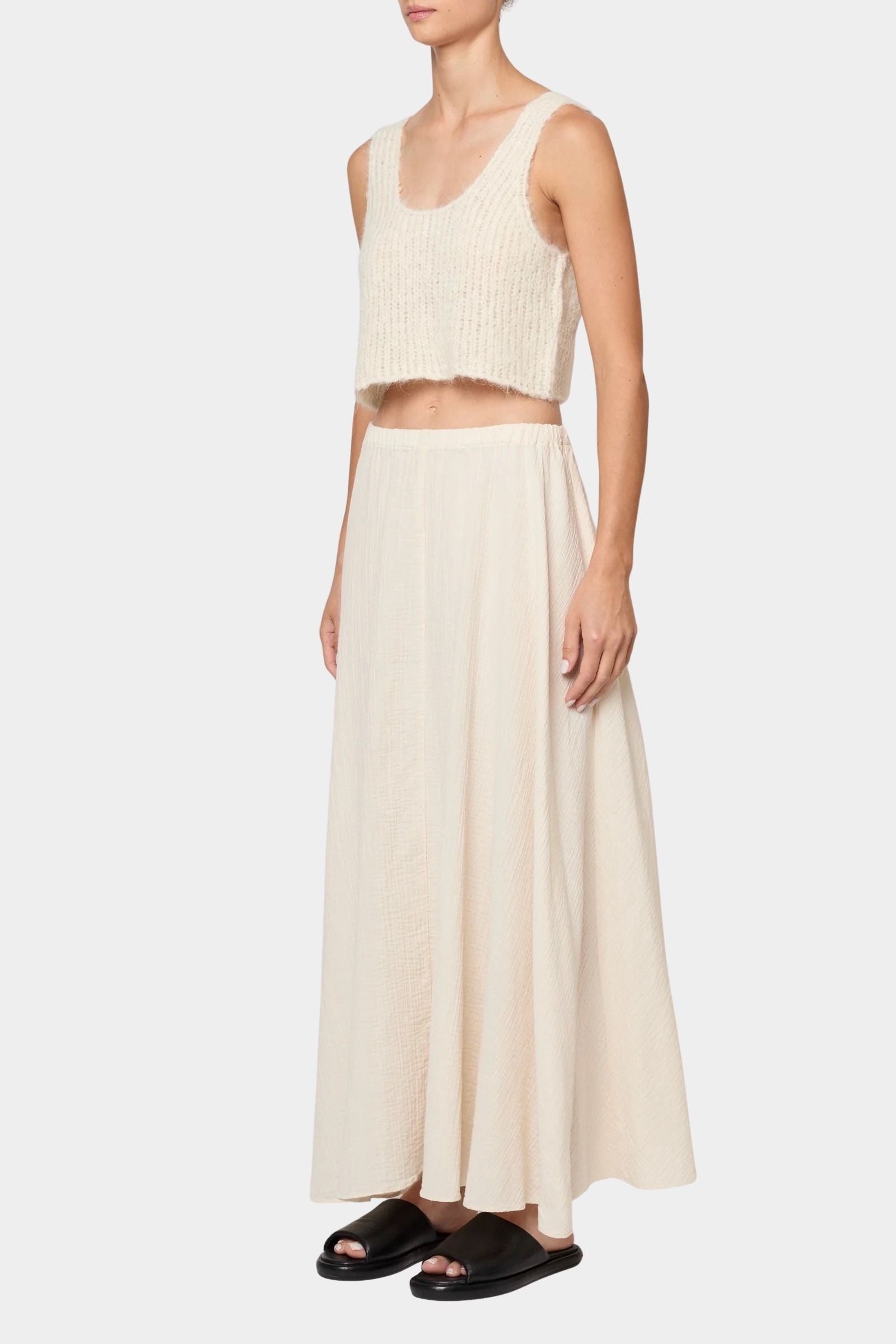 Atelier Delphine super crop sweater tank in cream front view with matching skirt showing cropped silhouette