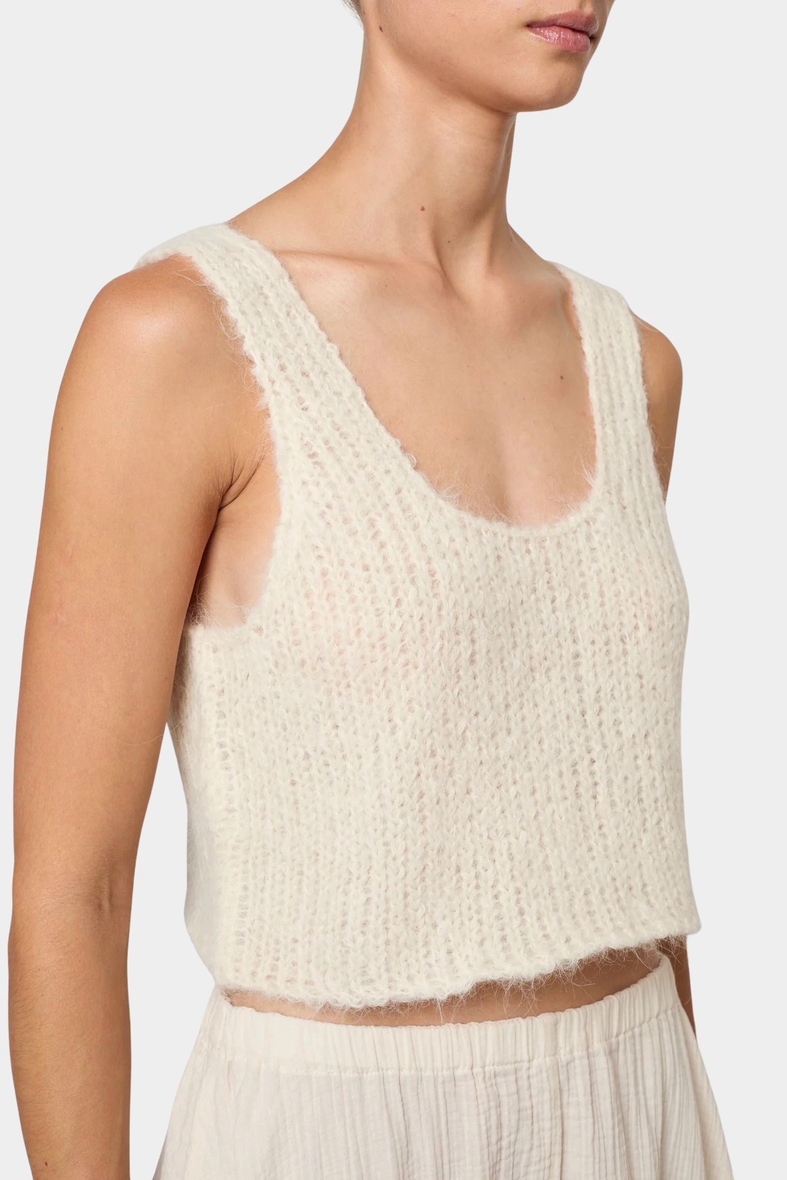 Atelier Delphine super crop sweater tank in cream front close-up showing scoop neckline and fuzzy knit texture